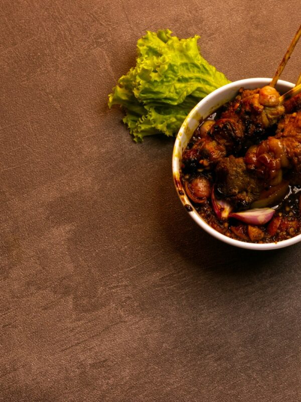 green vegetable on white ceramic bowl